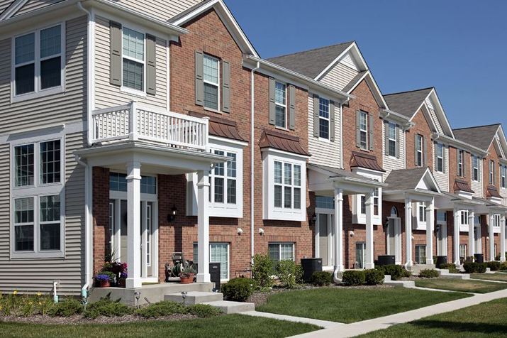 Reconnaître un immeuble résidentiel comme une maison à développement bloqué
